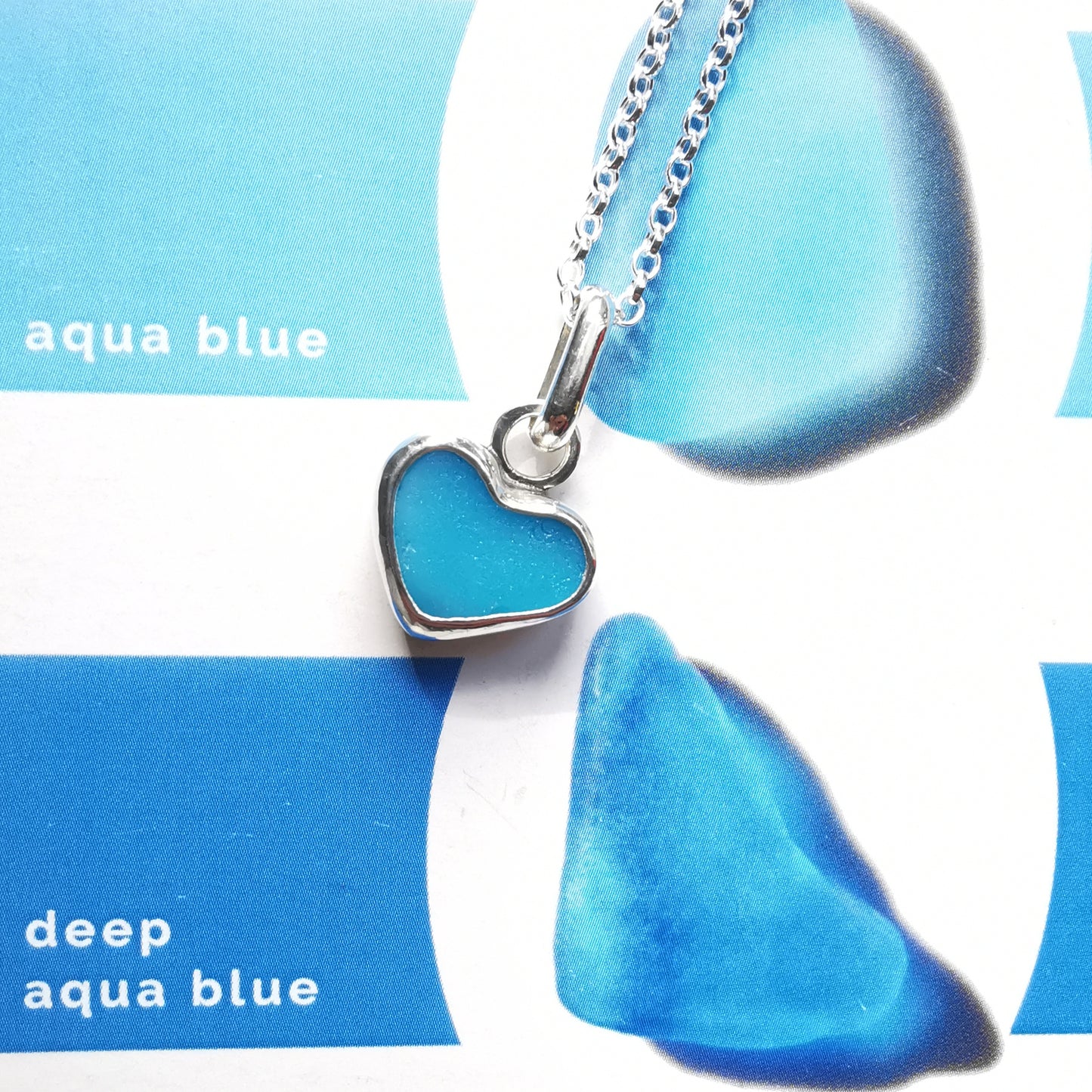 Aquamarine blue sea glass heart & sterling silver pendant.
