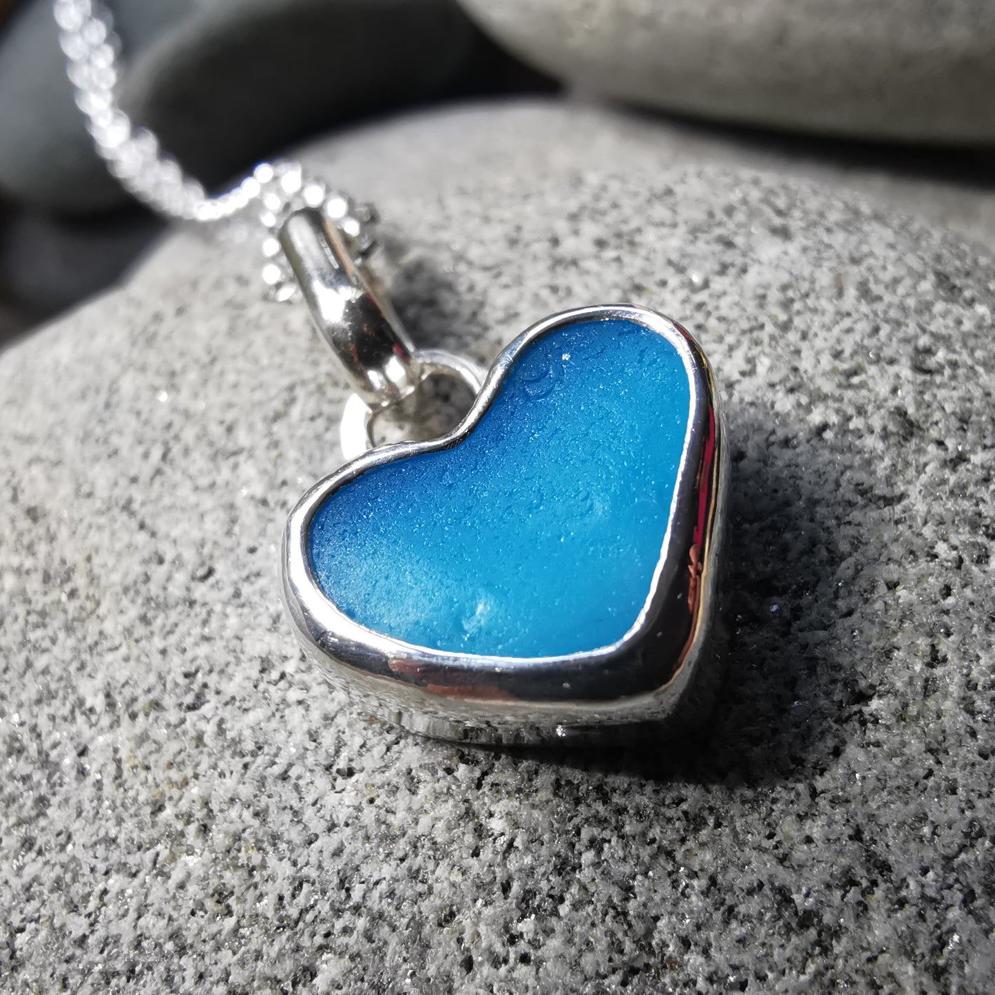 Aquamarine blue sea glass heart & sterling silver pendant.