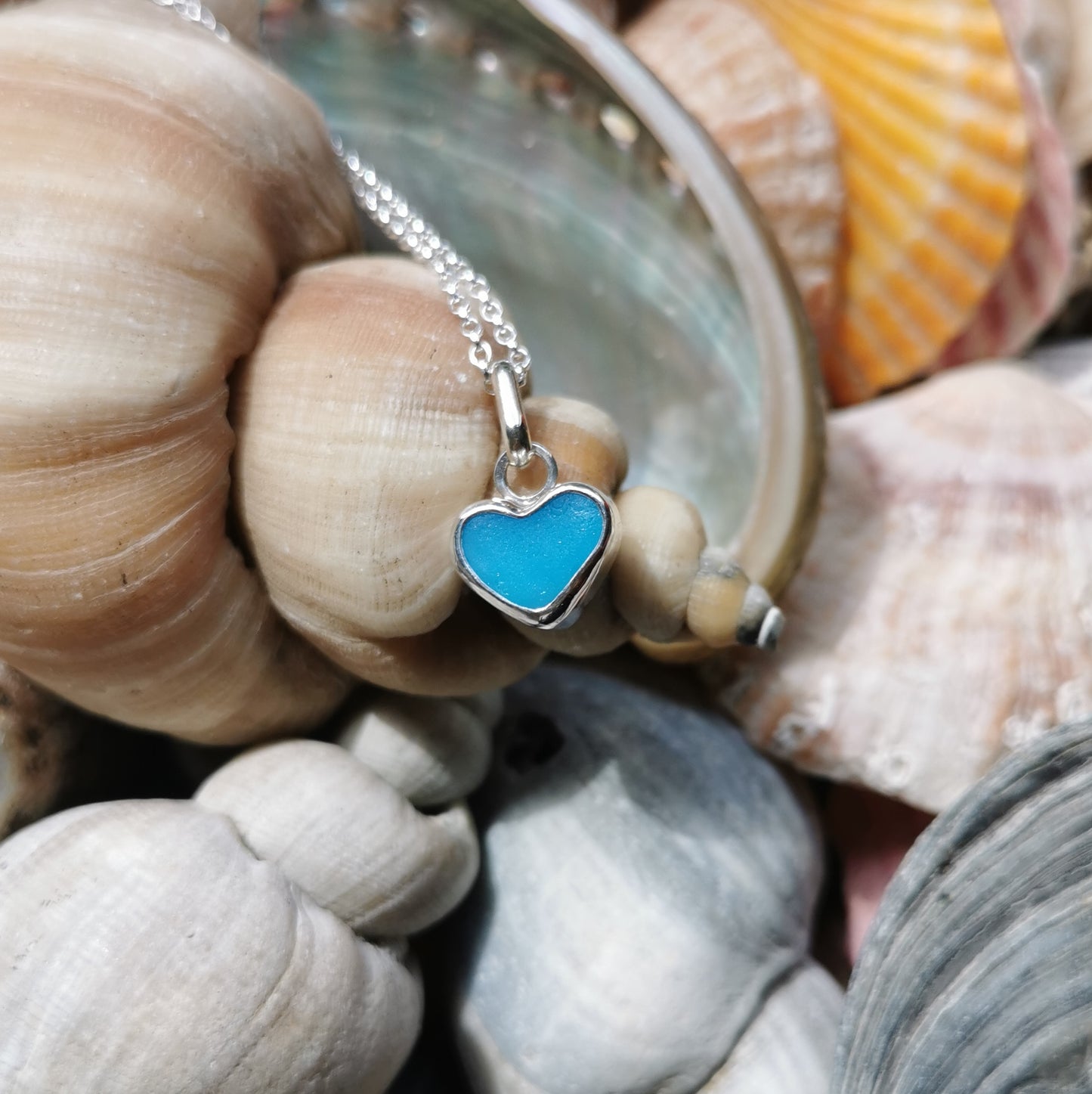 Aquamarine blue sea glass heart & sterling silver pendant.