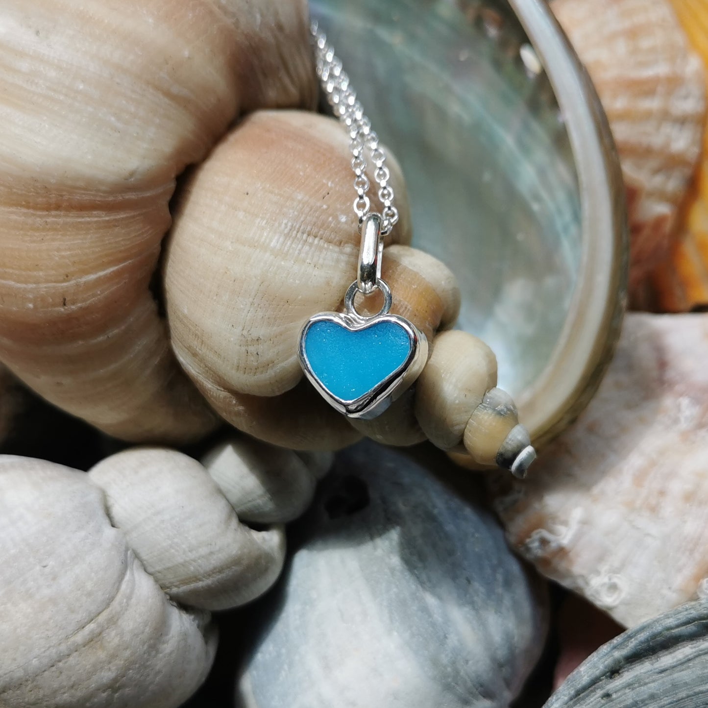 Aquamarine blue sea glass heart & sterling silver pendant.