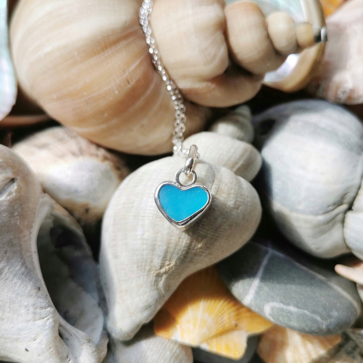 Aquamarine blue sea glass heart & sterling silver pendant.