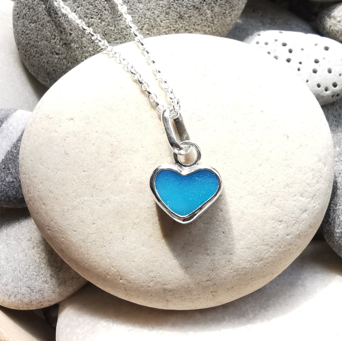 Aquamarine blue sea glass heart & sterling silver pendant.