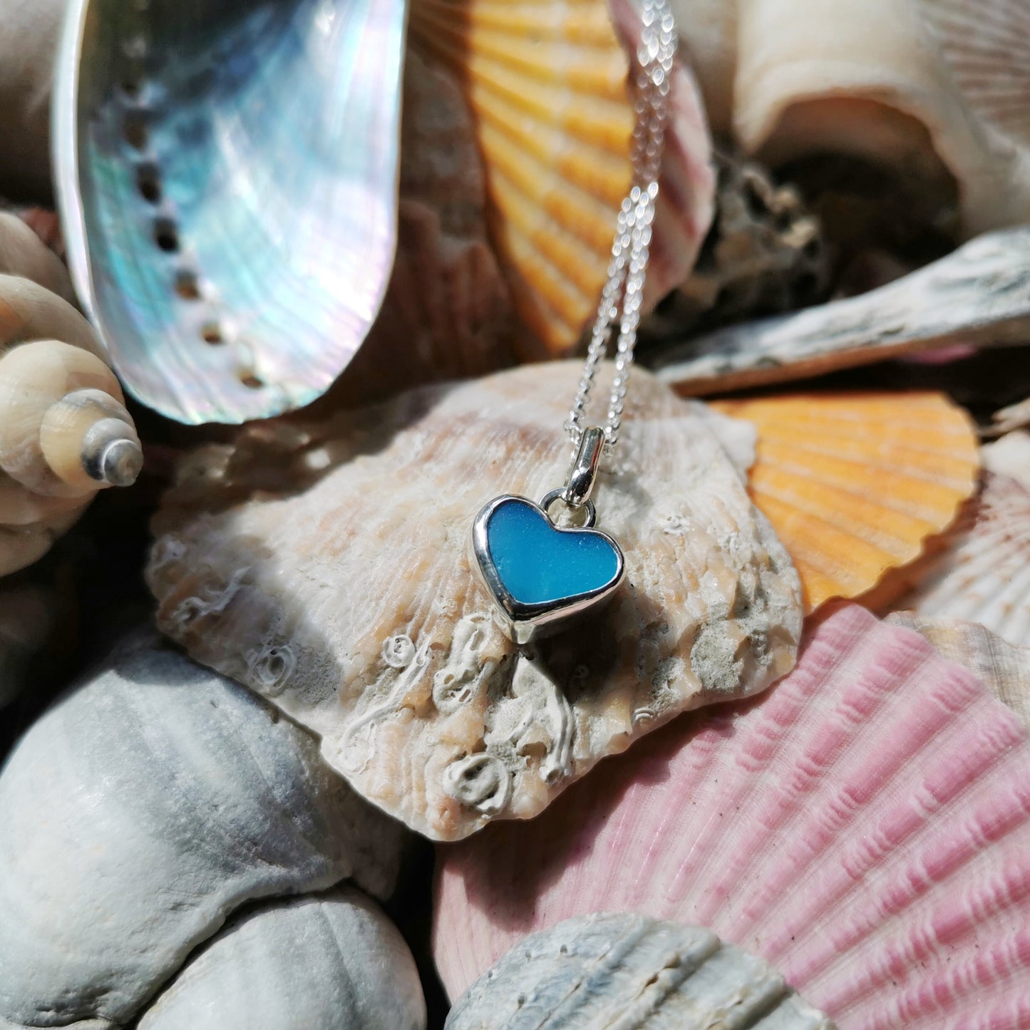 Aquamarine blue sea glass heart & sterling silver pendant.