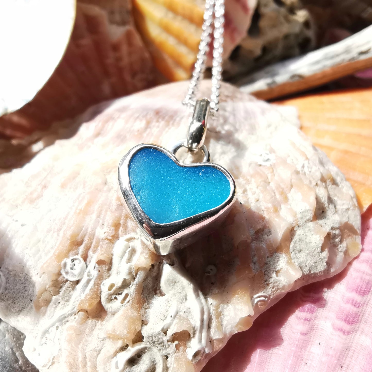 Aquamarine blue sea glass heart & sterling silver pendant.