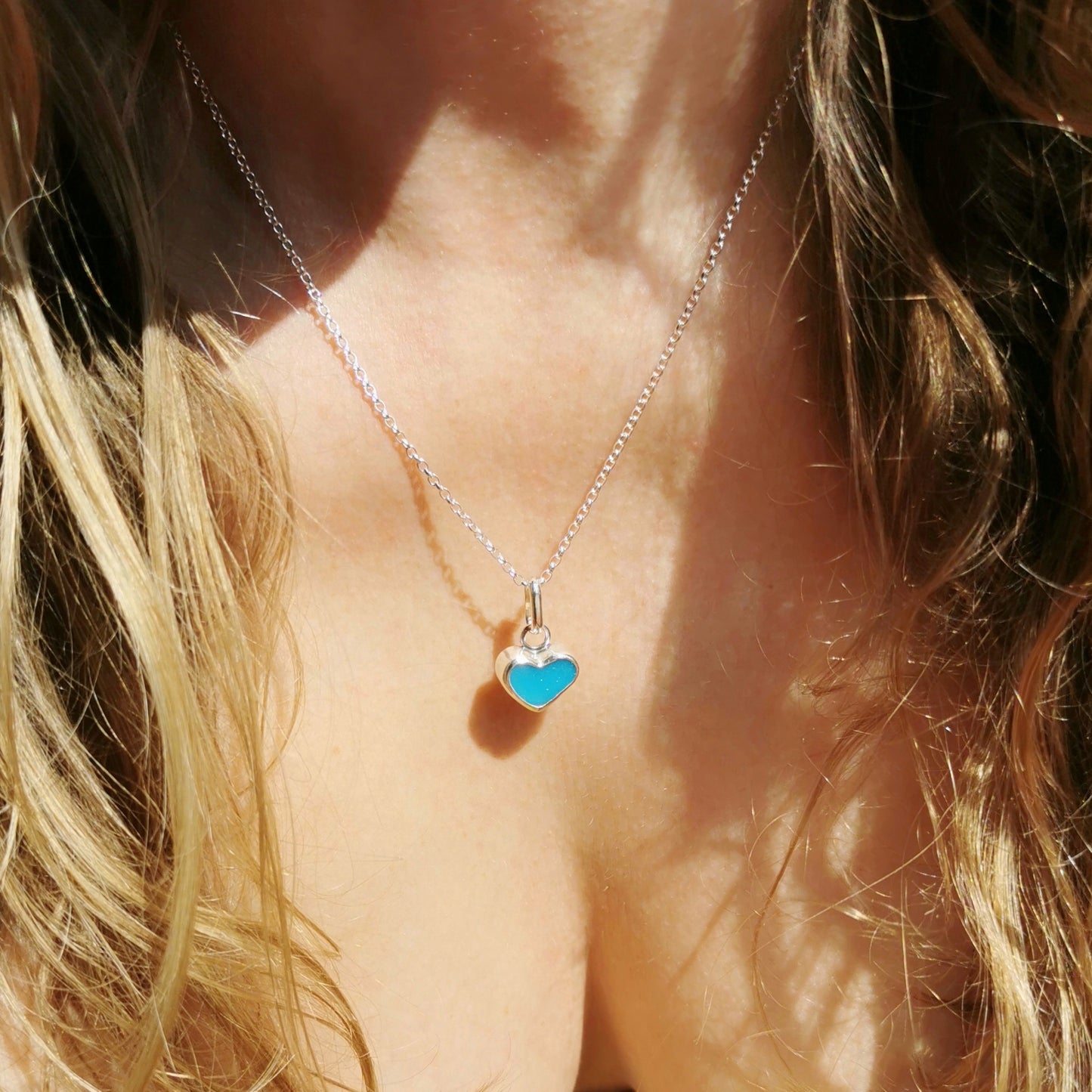 Aquamarine blue sea glass heart & sterling silver pendant.