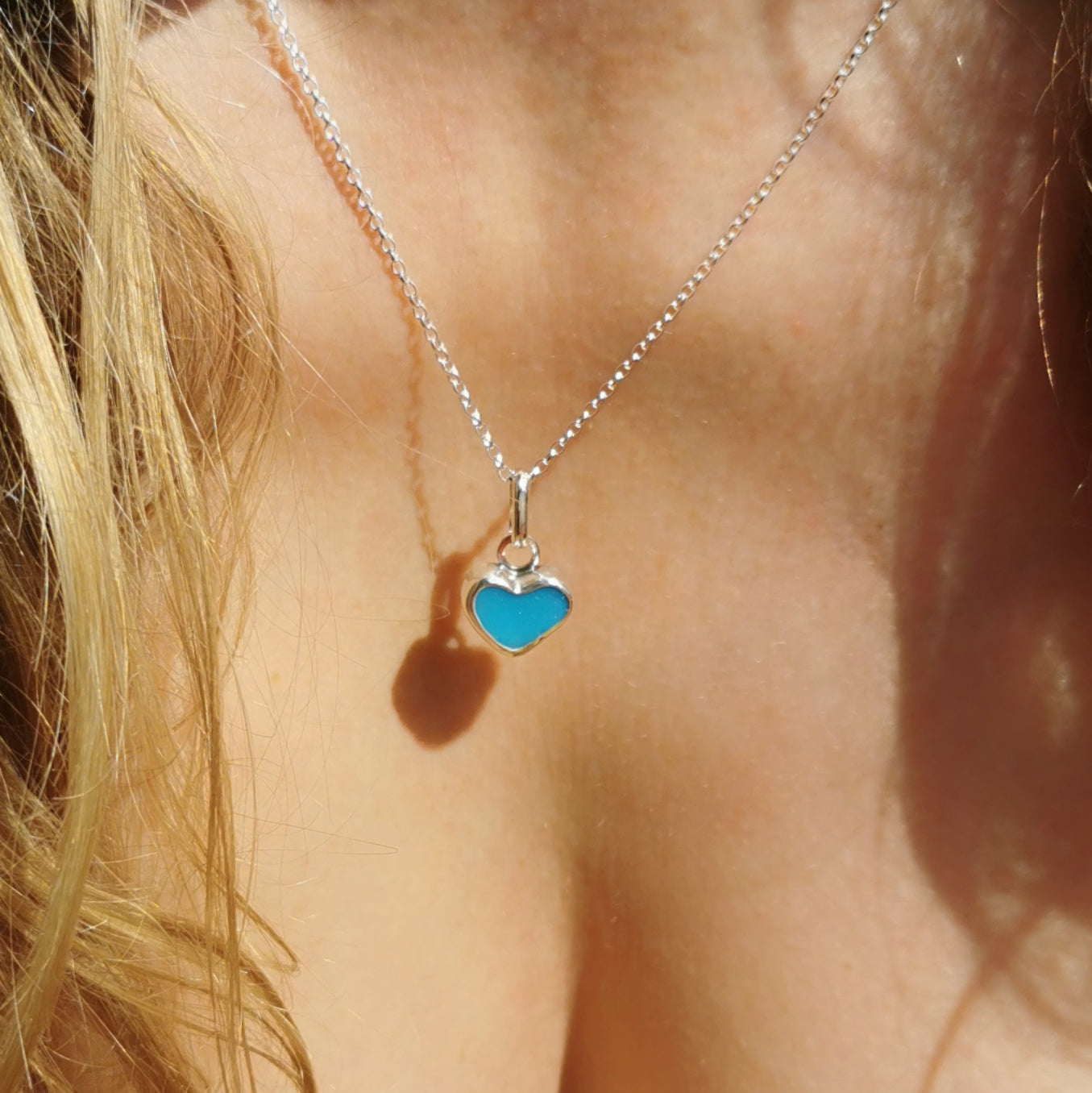 Aquamarine blue sea glass heart & sterling silver pendant.