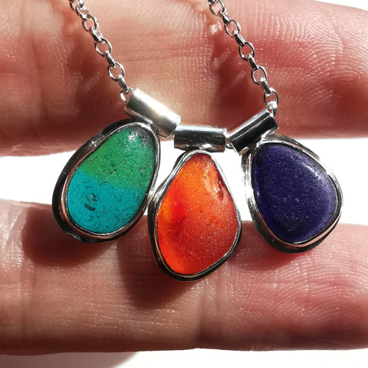 Genuine UV orange, teal and purple sea glass & sterling silver necklace.