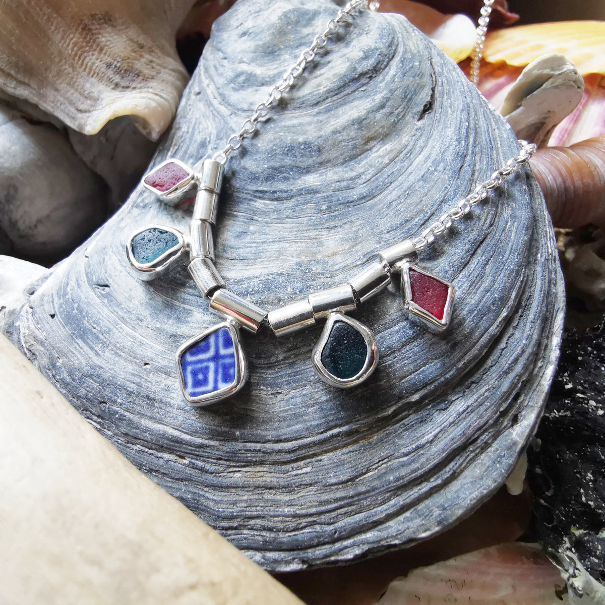 Genuine sea glass and sea pottery, sterling silver necklace.