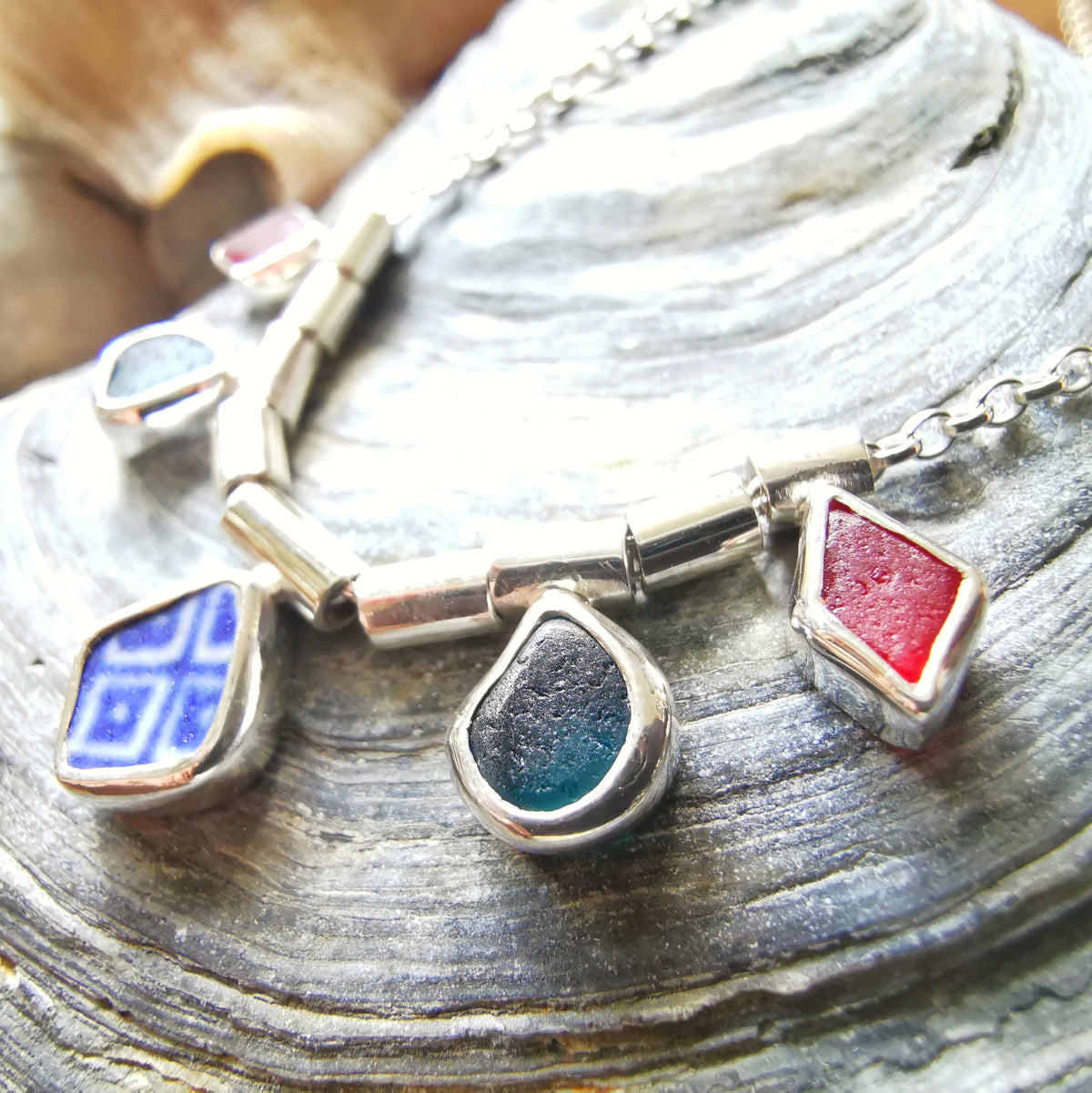 Genuine sea glass and sea pottery, sterling silver necklace.