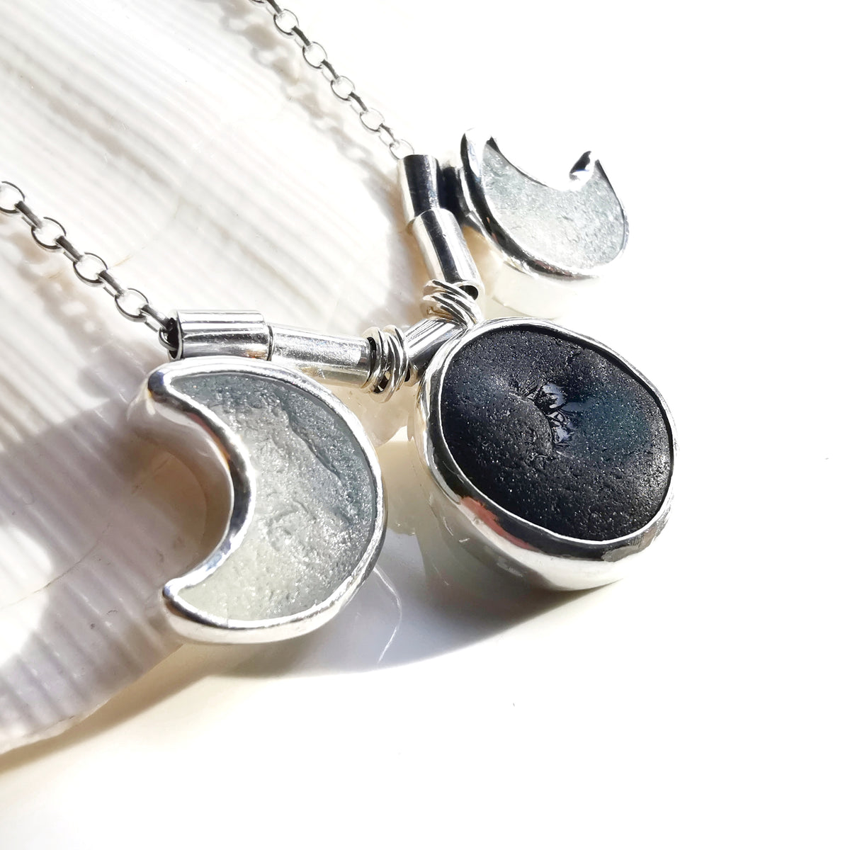 Genuine black and opalescent moon sea glass & sterling silver necklace.