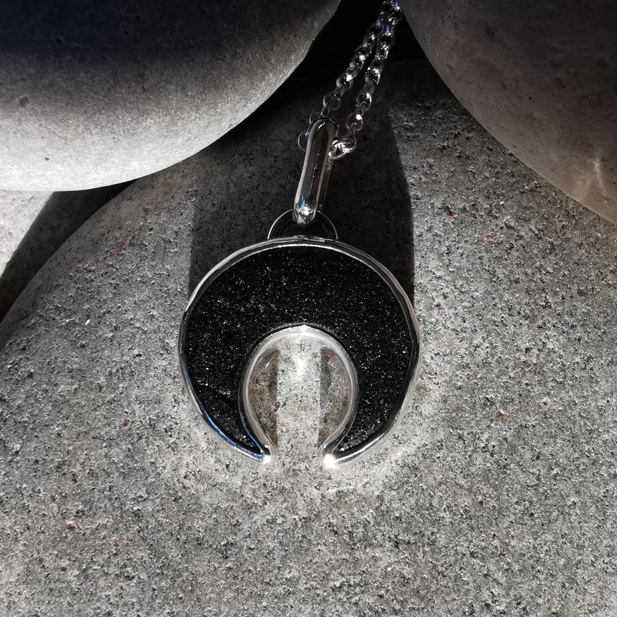 Scottish black sea glass inverted crescent & sterling silver pendant.