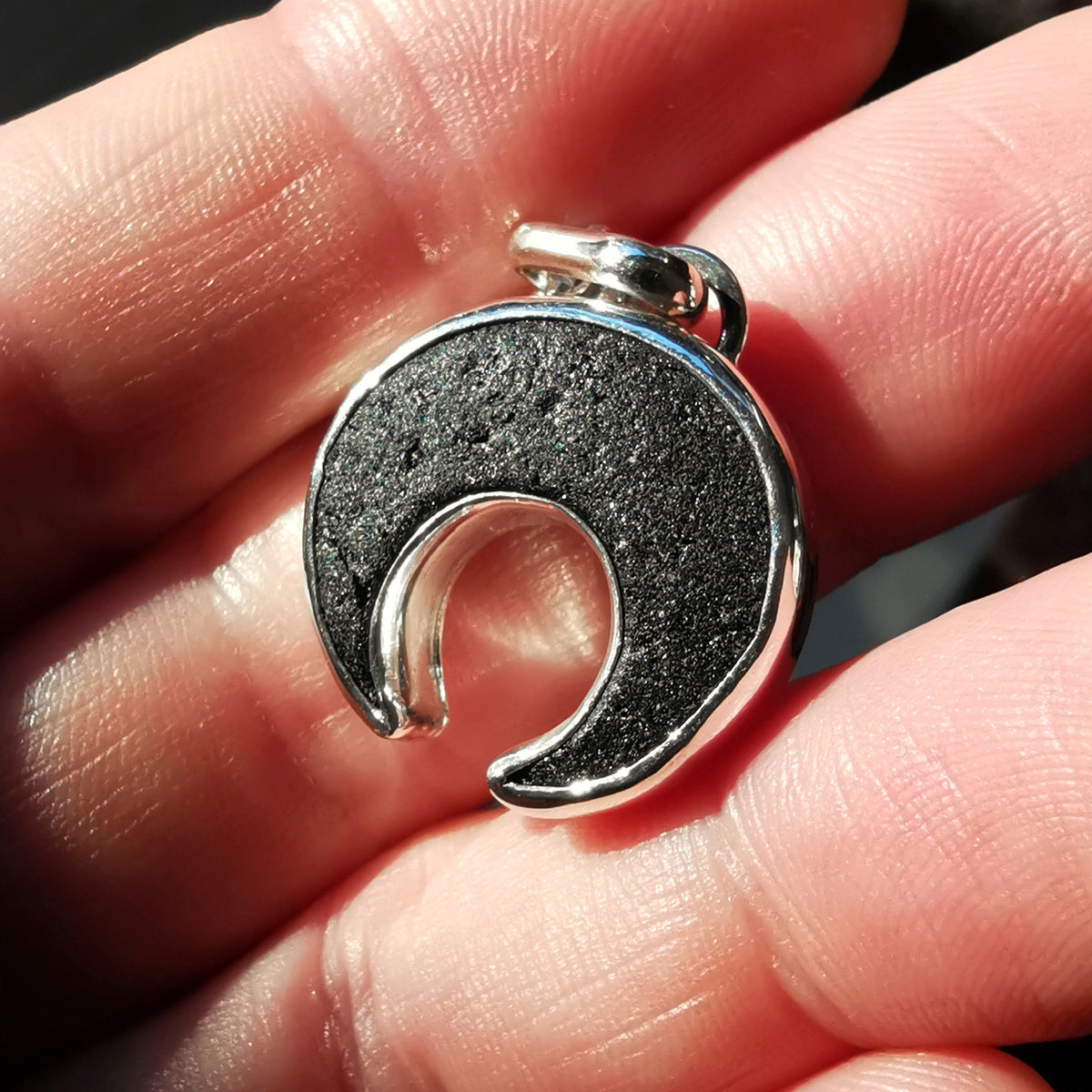 Scottish black sea glass inverted crescent & sterling silver pendant.