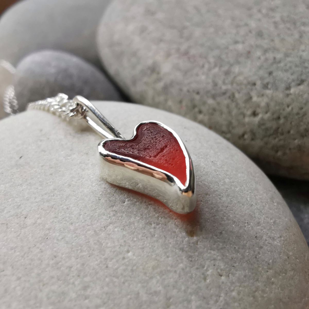 Tiny Scottish orange sea glass heart  & sterling silver pendant.