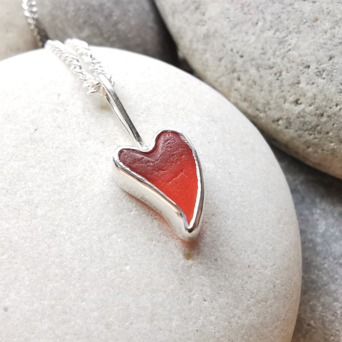 Tiny Scottish orange sea glass heart  & sterling silver pendant.