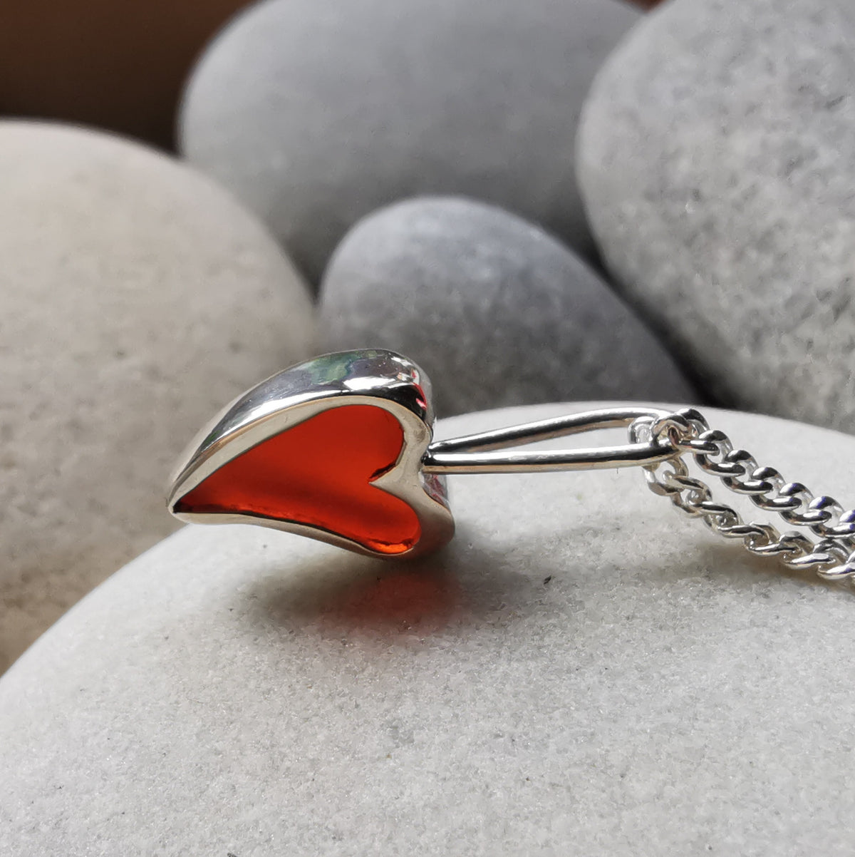 Tiny Scottish orange sea glass heart  & sterling silver pendant.