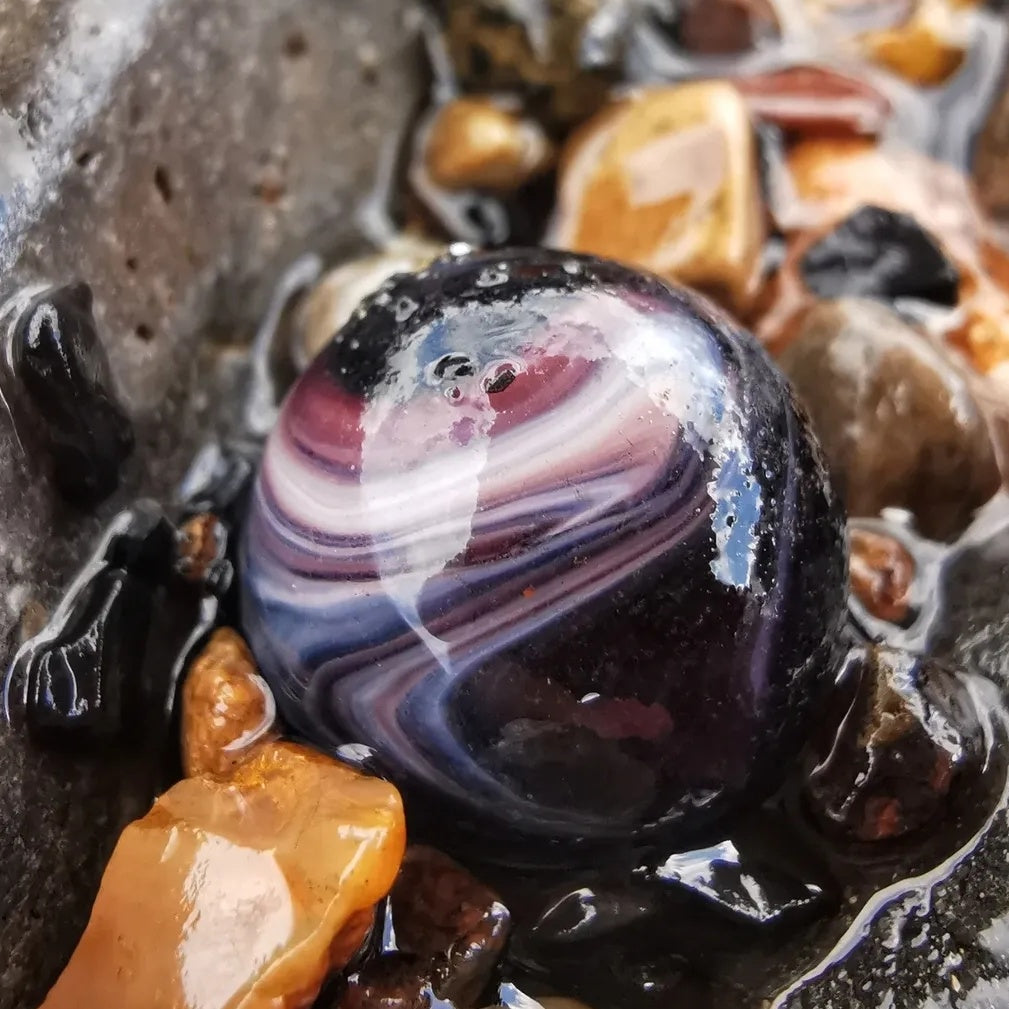 Genuine Scottish purple sea glass marble & sterling silver pendant.