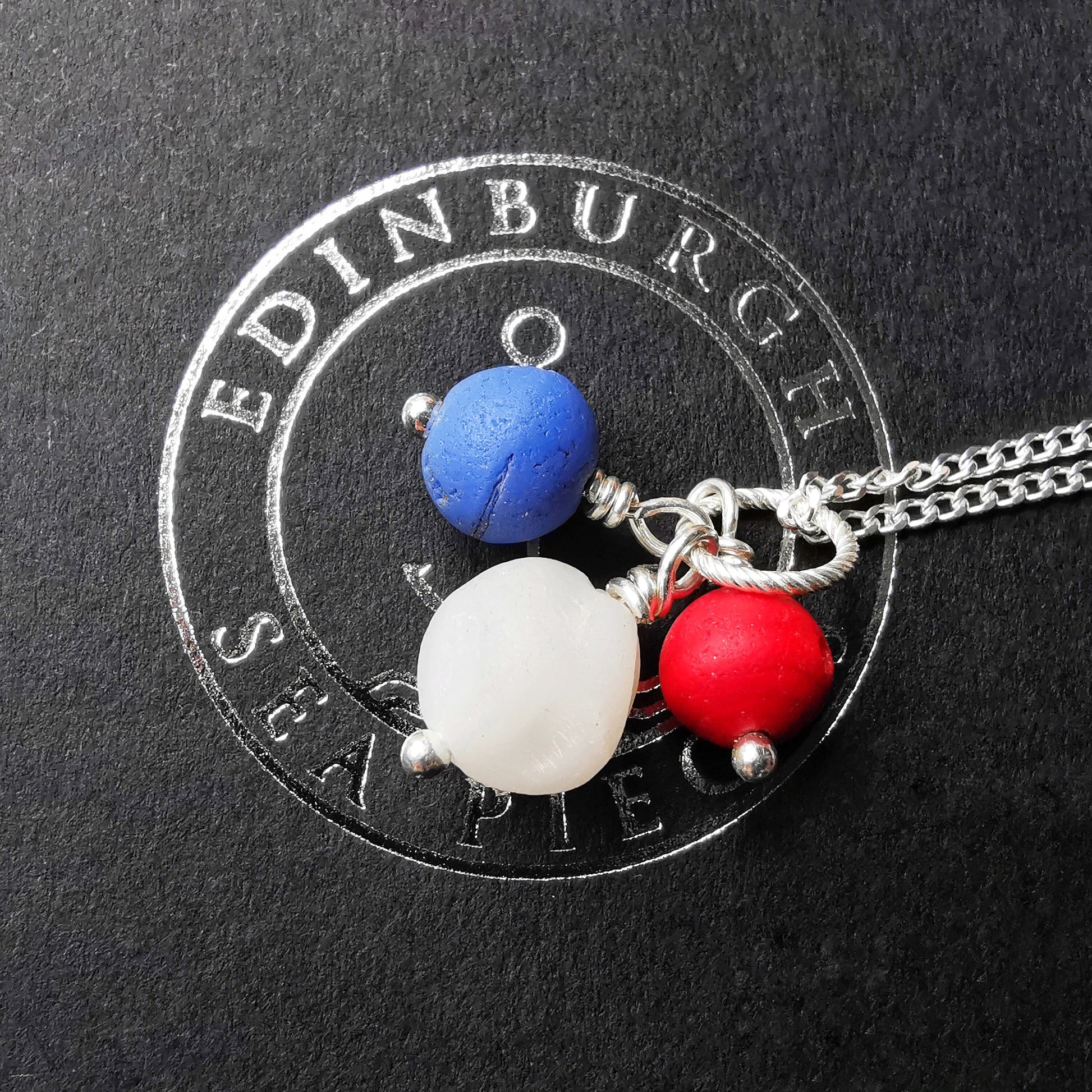 Scottish trio of sea glass beads in blue, red and white, sterling silver necklace - monopatin