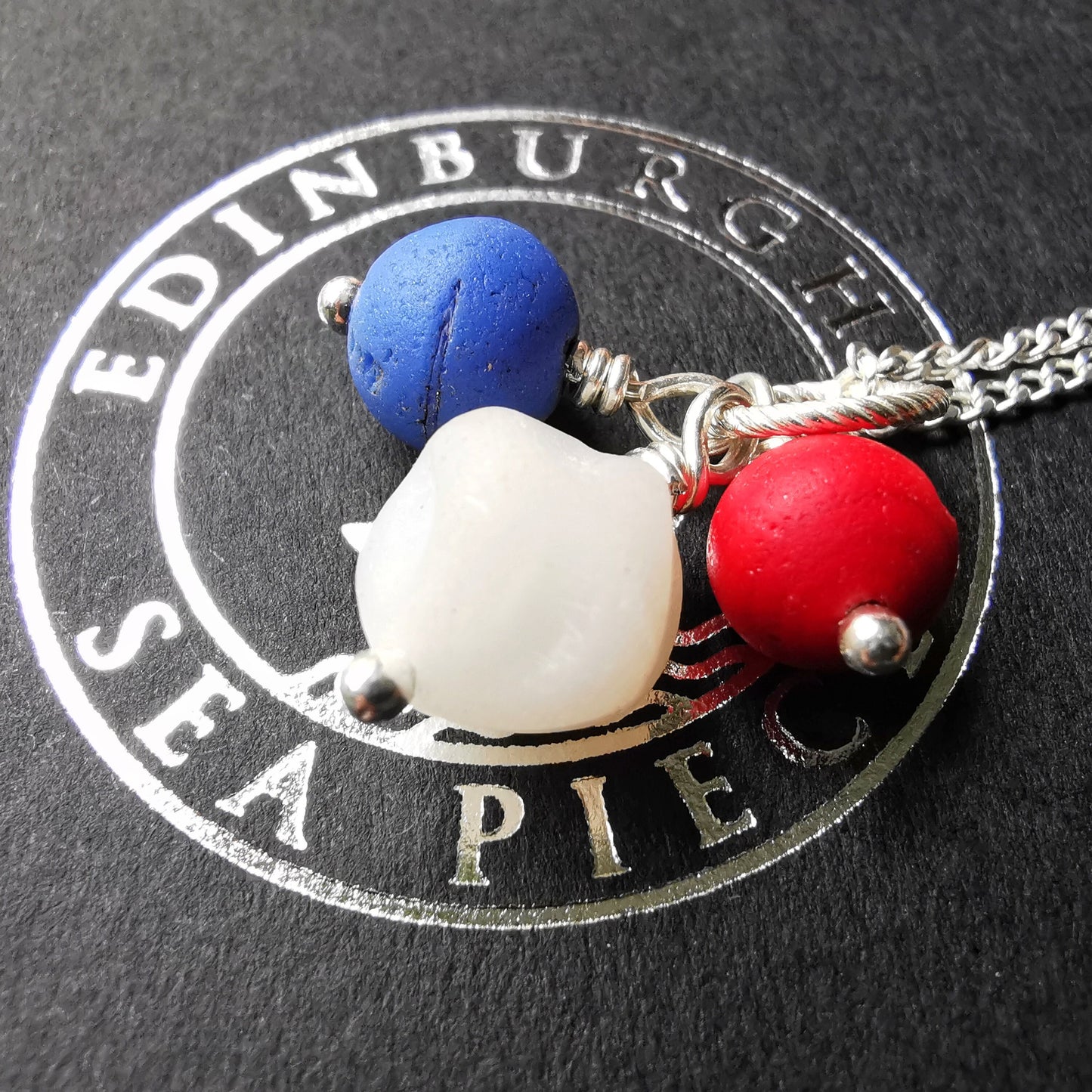 Scottish trio of sea glass beads in blue, red and white, sterling silver necklace - monopatin